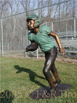Boy Running With Football bronze statue